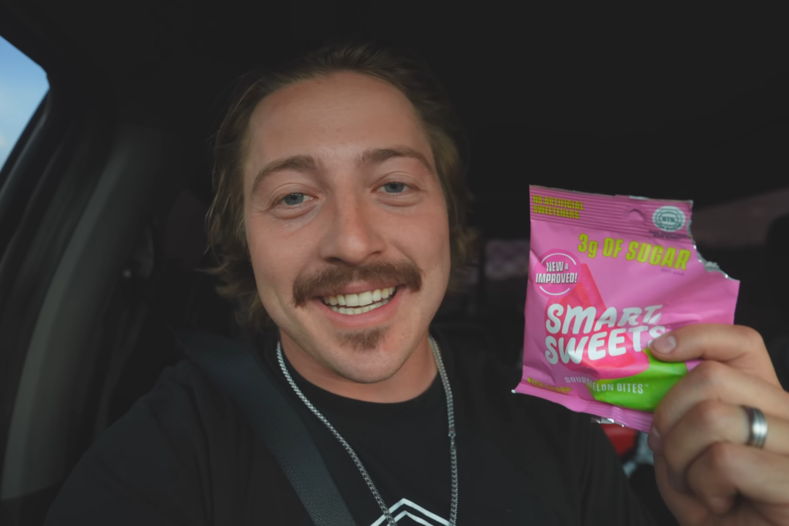 Creator holding a SmartSweets product